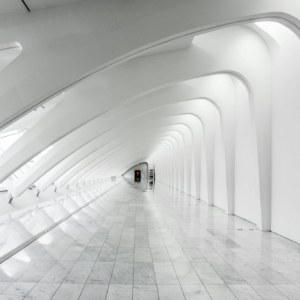 Explore the sweeping modern arches and minimalistic design of the Milwaukee Art Museum's white hallway.